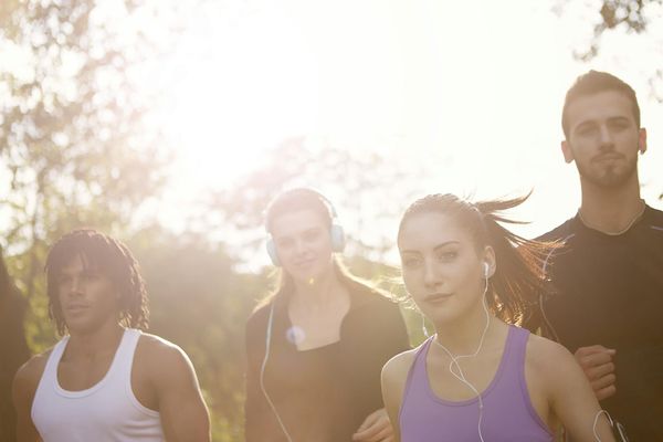 Diverse group of people smiling during a light activity.